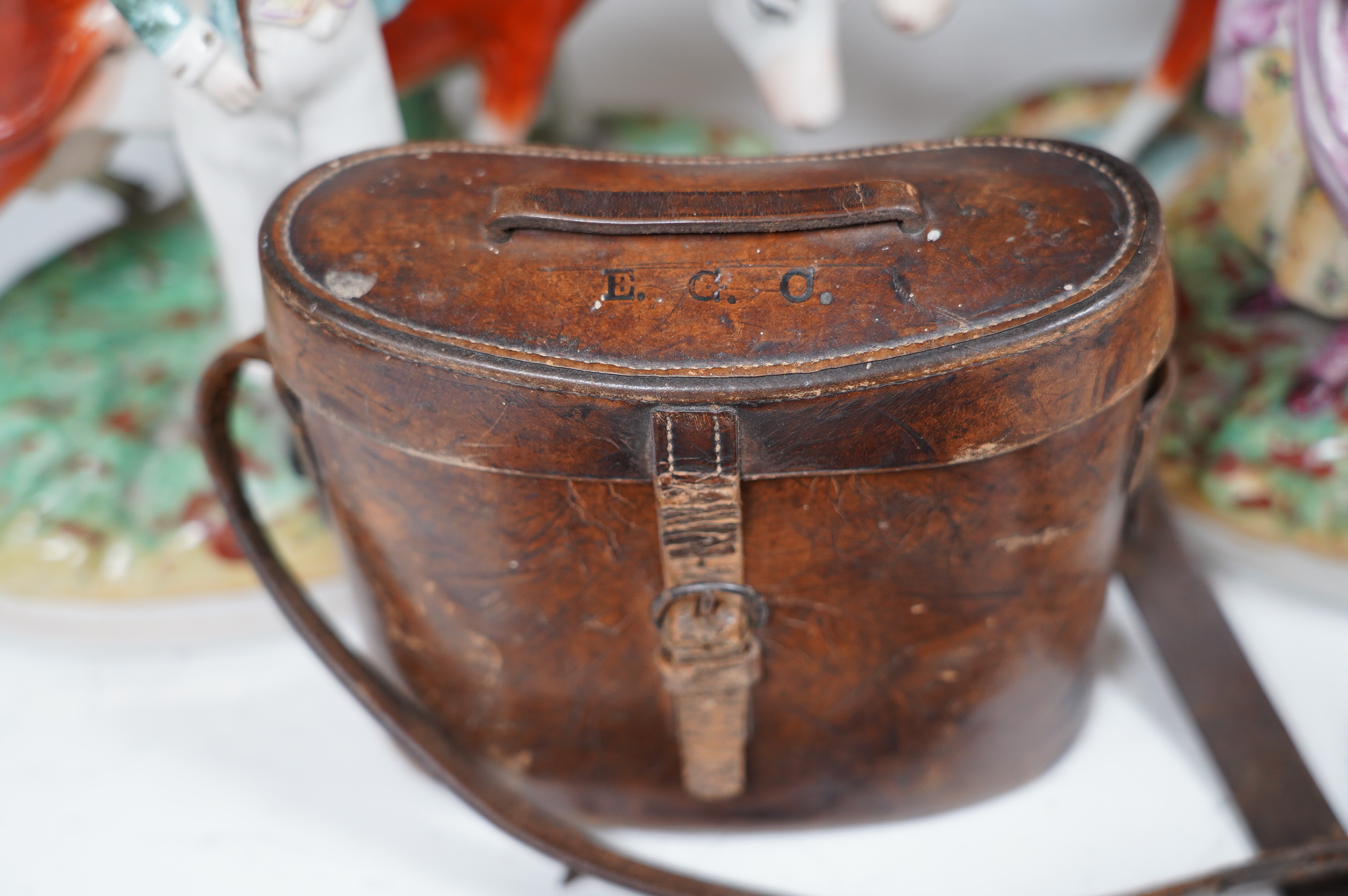 A pair of Staffordshire cow groups, two boxes and a cased pair of binoculars. Condition - fair